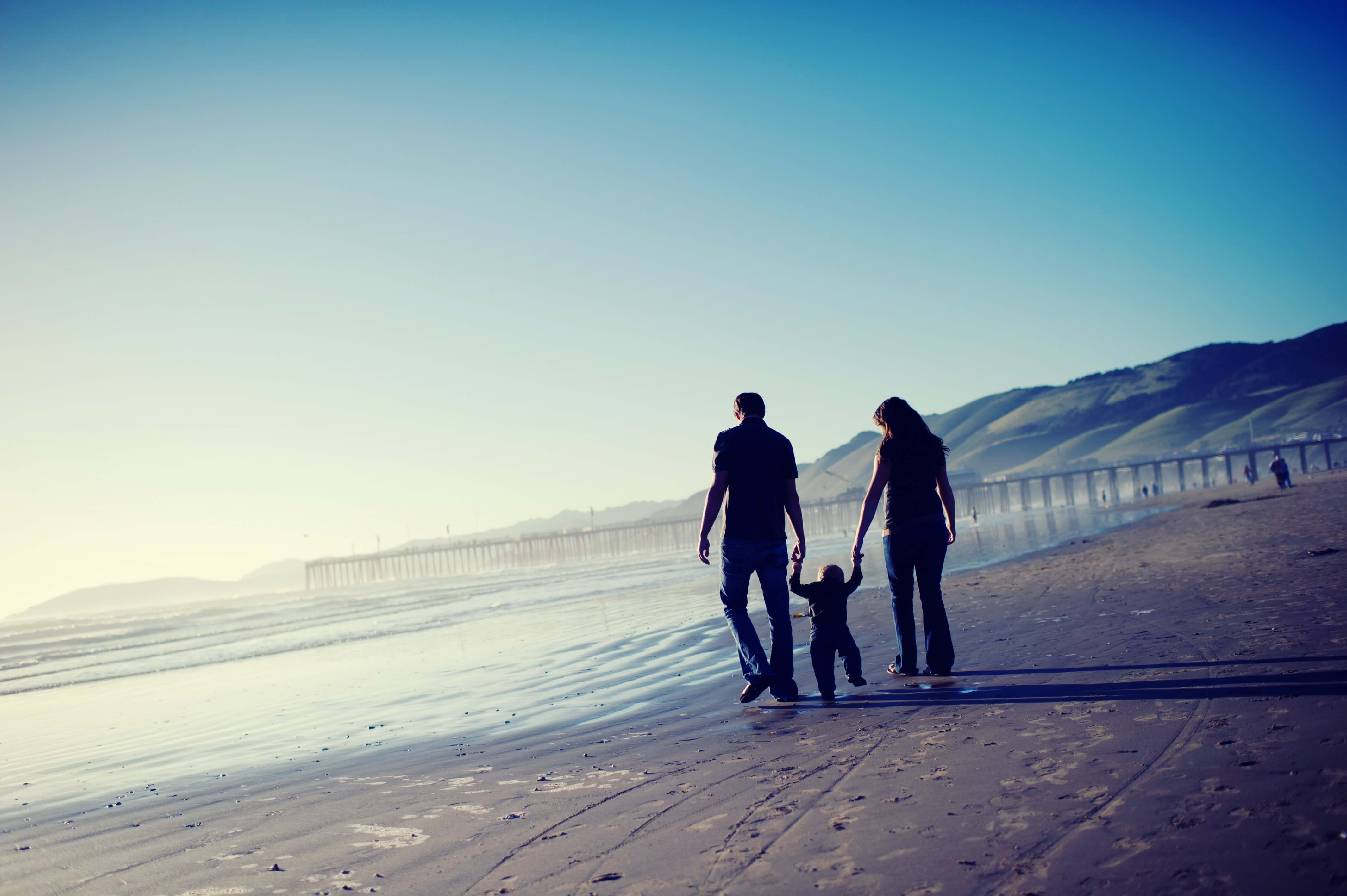 Family walking along the beach
